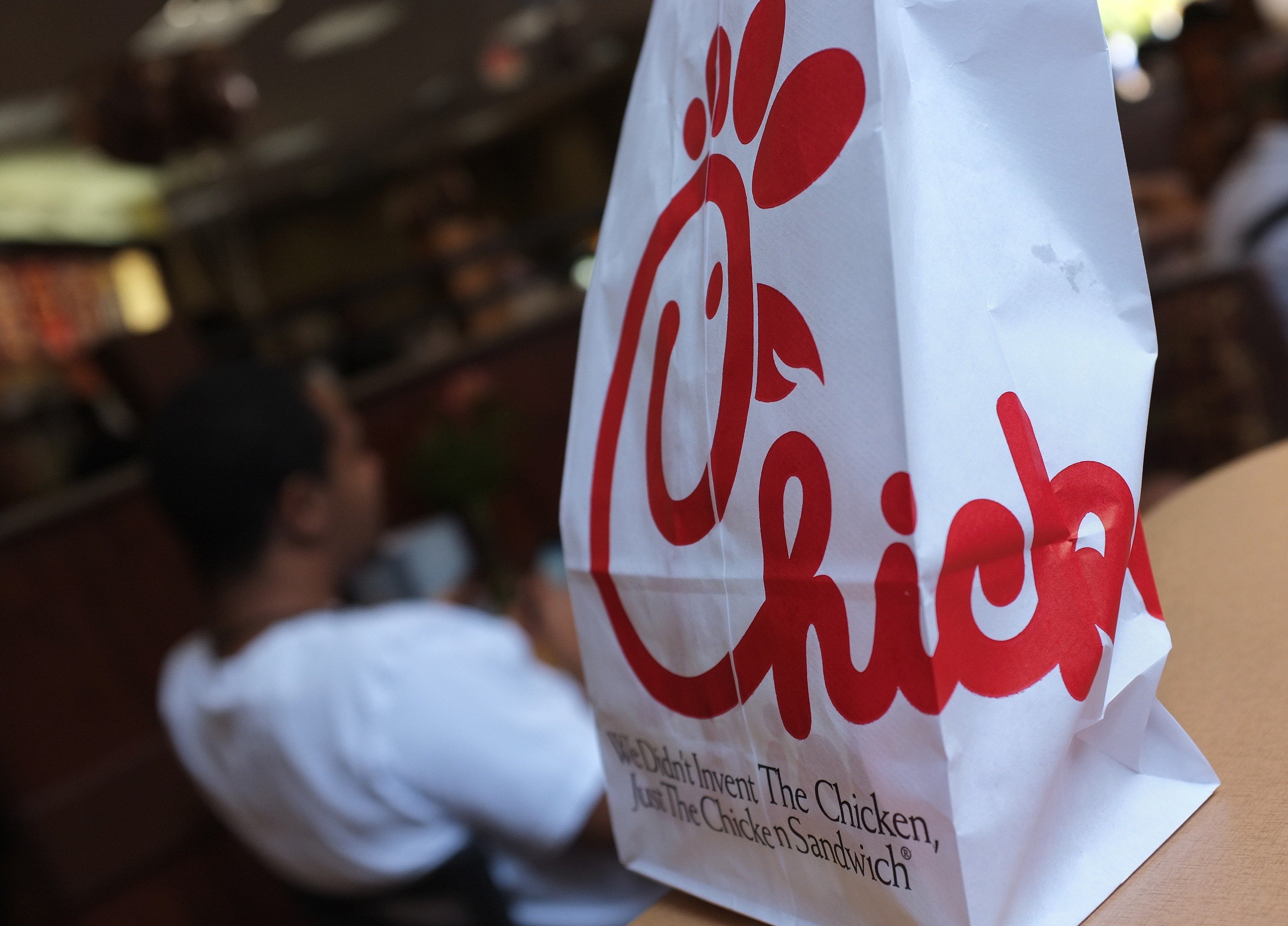 A Chick-fil-A logo is seen on a take out bag
