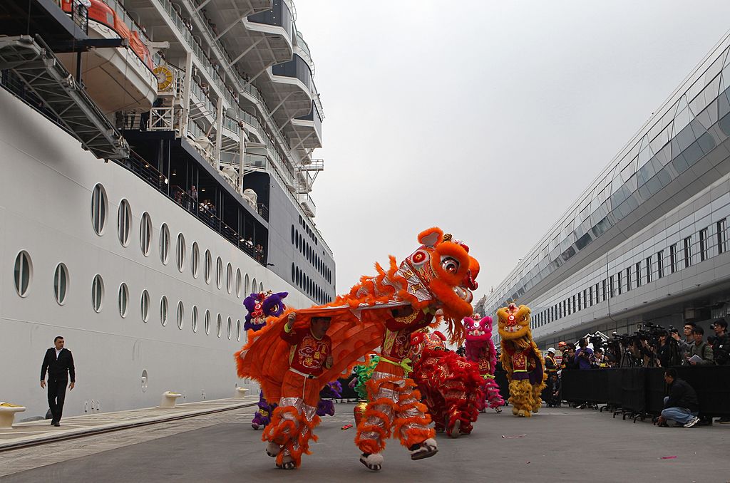 Dancers perform to welcome the Celebrity Millennium ship