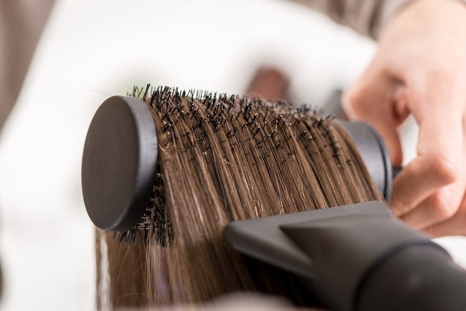 drying brown hair with hair dryer