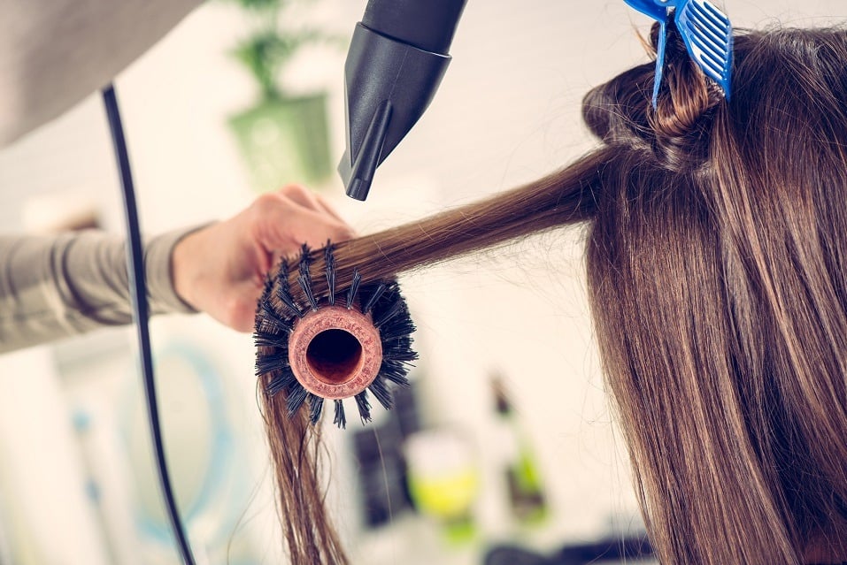 drying brown hair with hair dryer