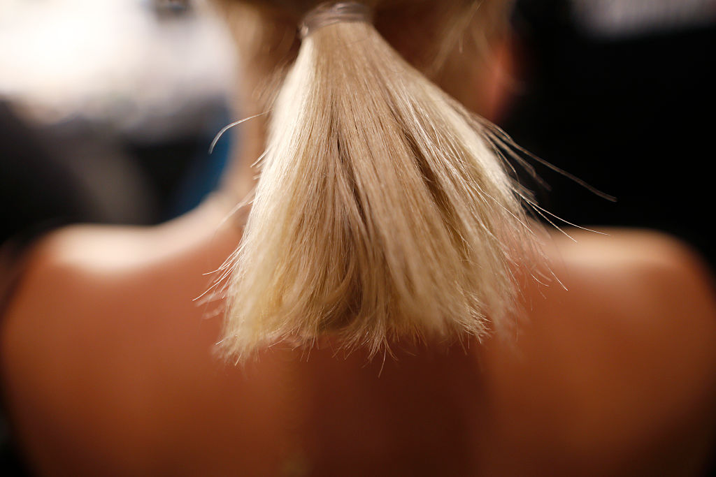 A model (hair detail) is seen backstage ahead of the Laurel show during the Mercedes-Benz Fashion Week