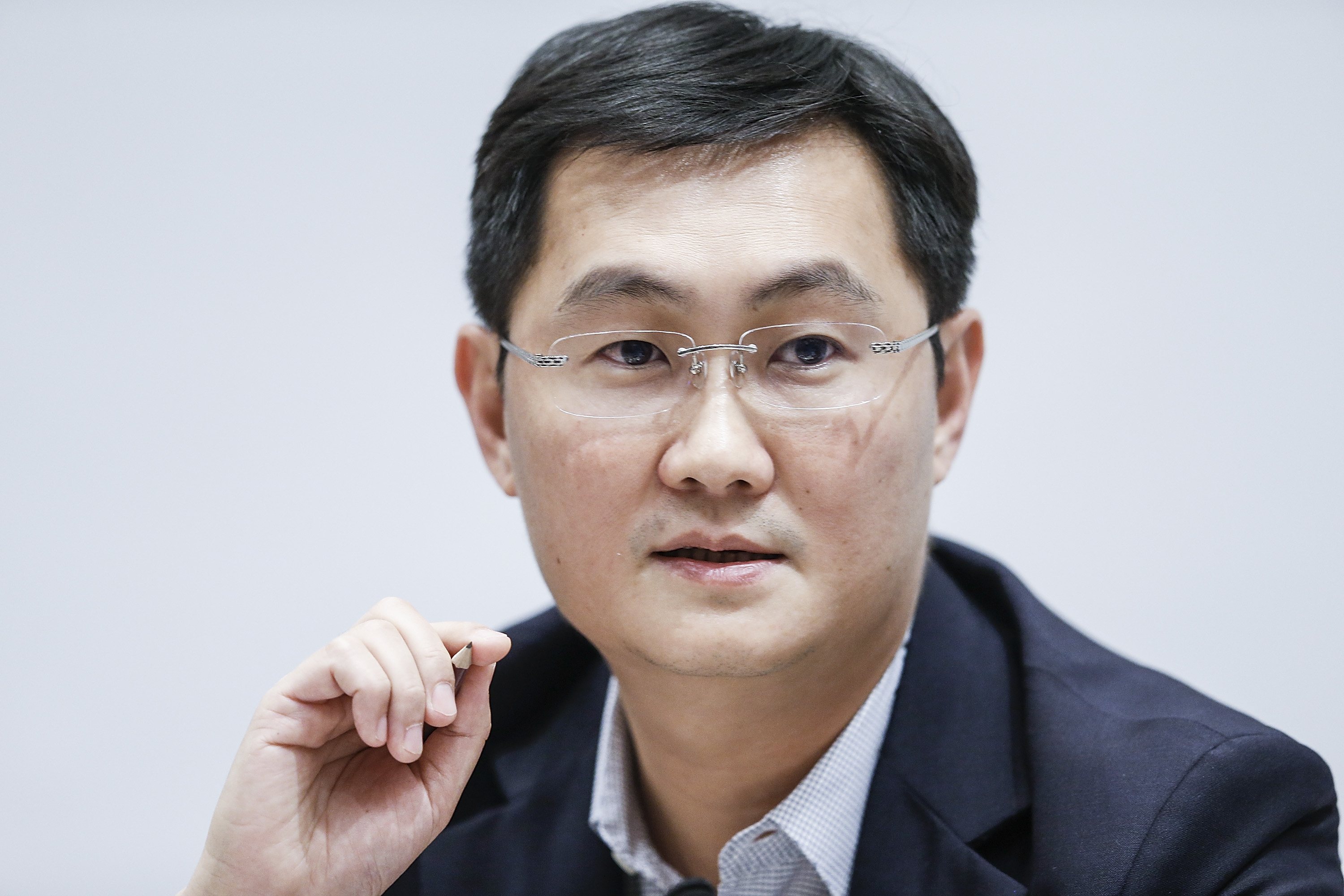 Pony' Ma Huateng, chairman and chief executive officer of Tencent Holdings Ltd., speaks at a news conference