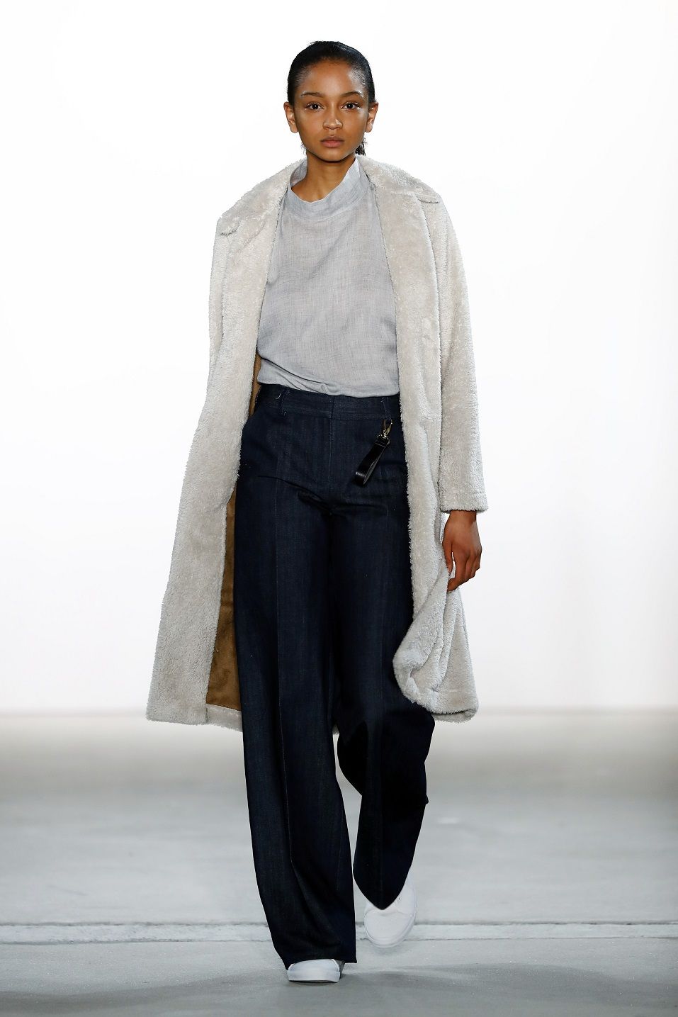 A model walks the runway at the Hien Le show during the Mercedes-Benz Fashion Week Berlin