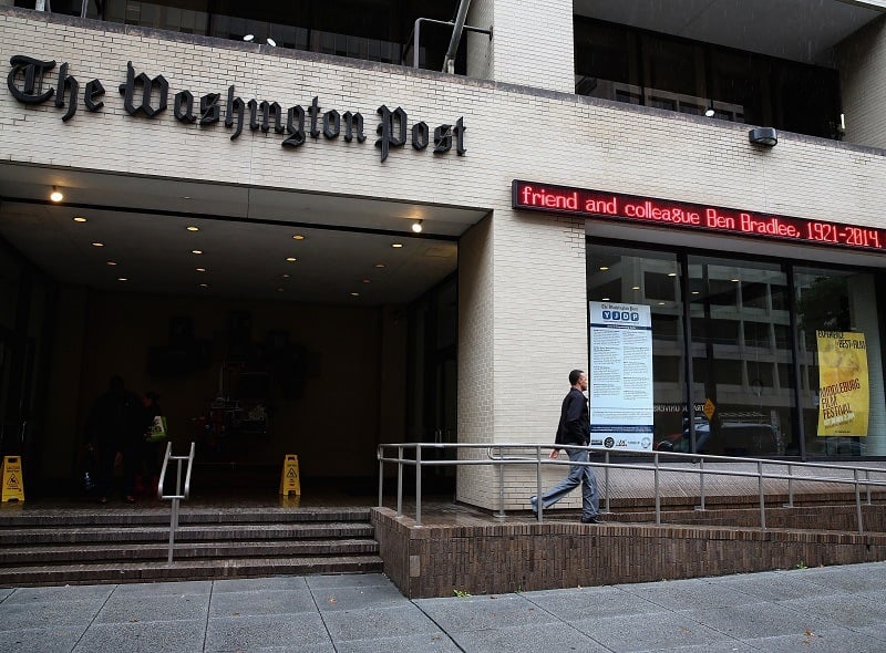 A scrolling marquee in front of the Washington Post building