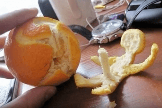 orange peeled to resemble anatomy