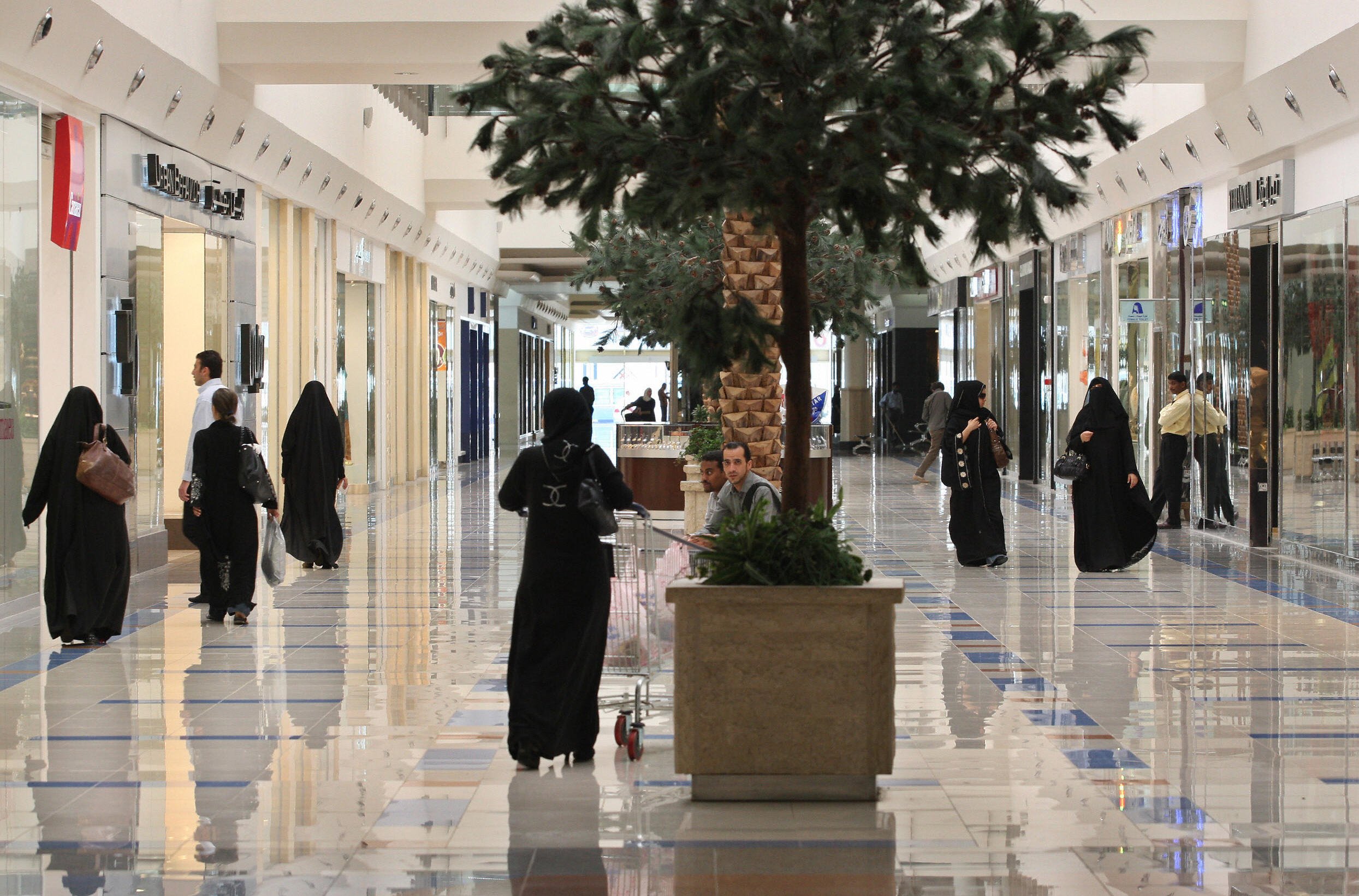 Saudi women walk at a shopping mall in the Saudi capital of Riyadh
