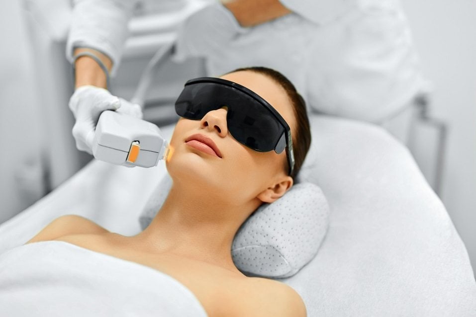 Young Woman Receiving Facial Beauty Treatment