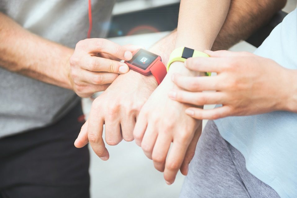 Fitness trackers on wrists