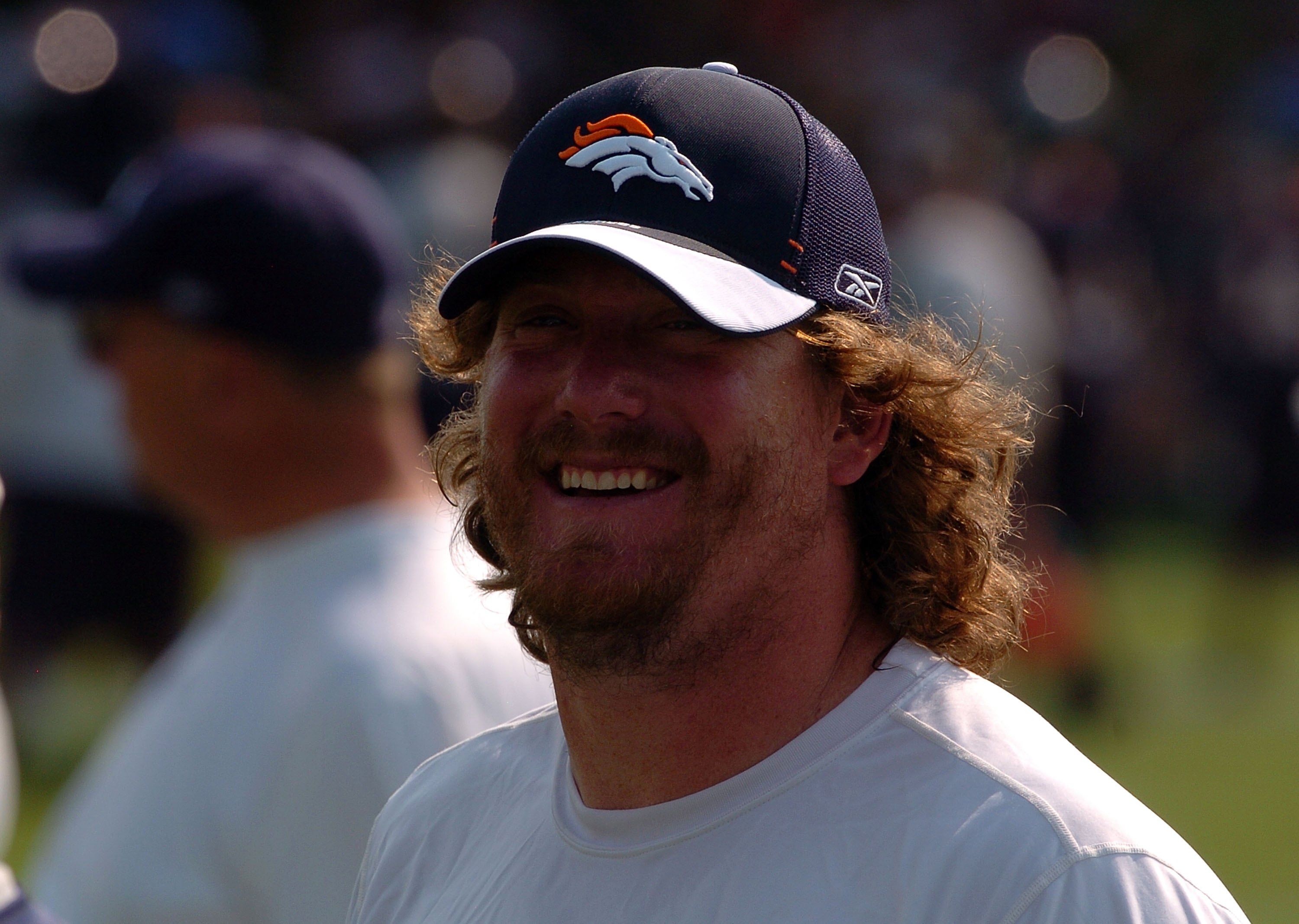 Tom Nalen smiles on the sidelines | Steve Dykes/Getty Images