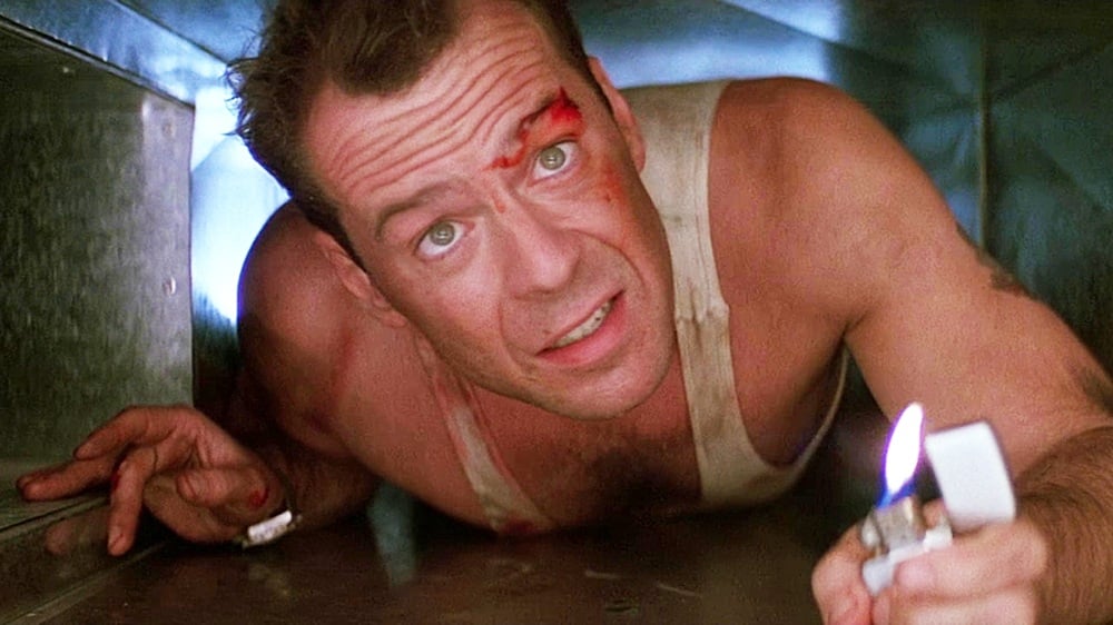 Bruce Willis is crawling in an air vent in Die Hard.