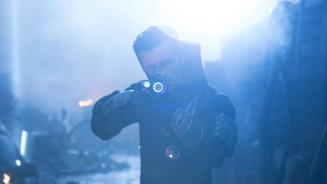 Josh Hutcherson wears armor and holds up a gun in Future Man