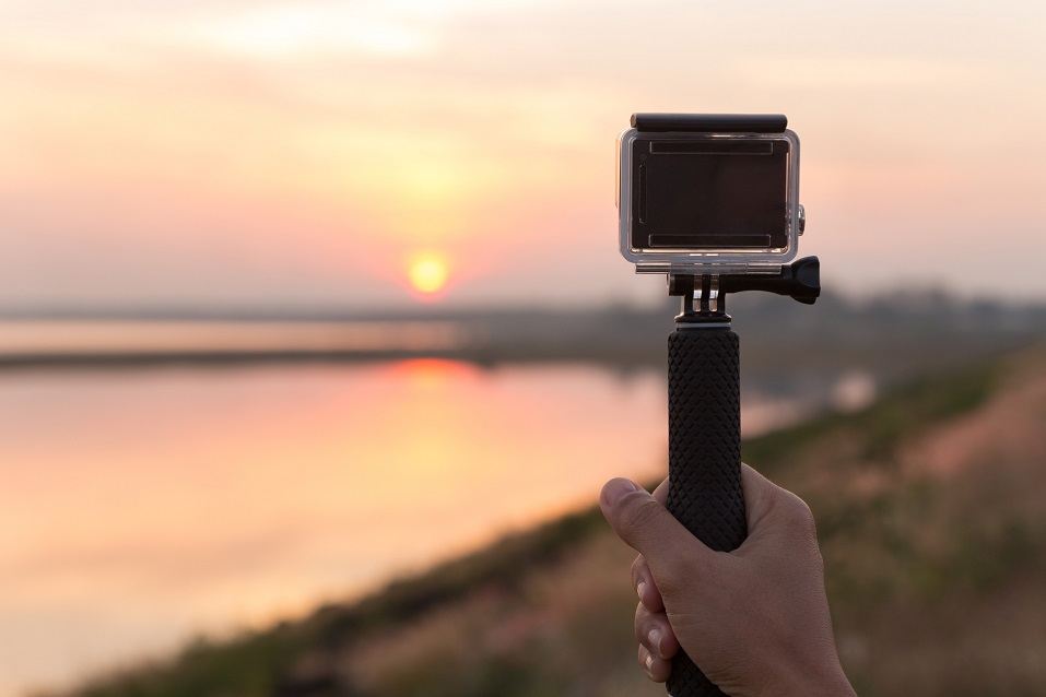 a hand holding an extreme camera