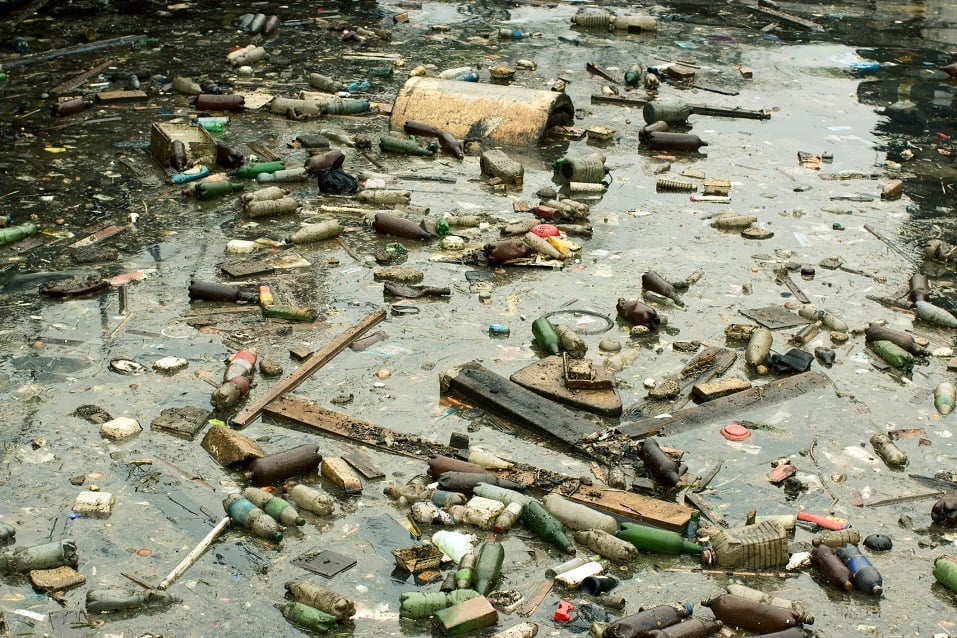 Trash and oil pollutes a beach