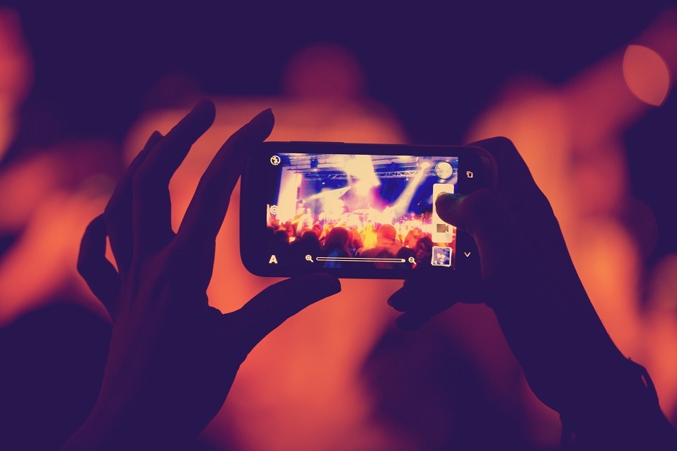 a woman taking a series of photos to post to Instagram with Instagram captions