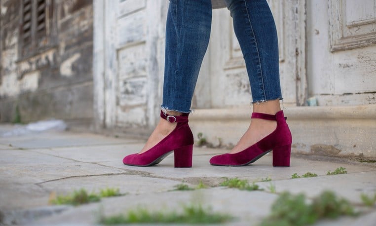 Woman with purple high heal shoes