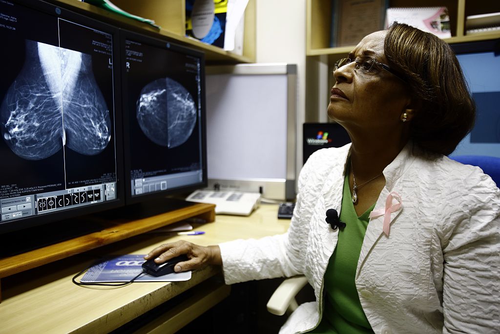 A radiologist works with a cancer patient