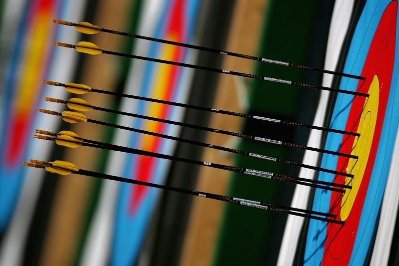Arrows are seen embedded in a target, a metaphor for goal-setting and purpose