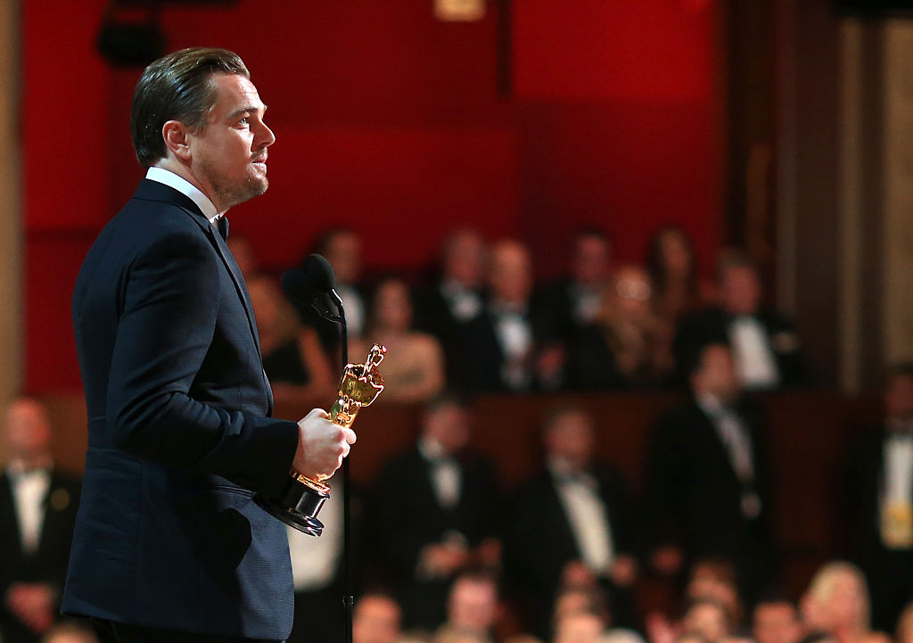 Actor Leonardo DiCaprio accepts the Oscar statue the Best Performance by an Actor in a Leading Role award for 'The Revenant'