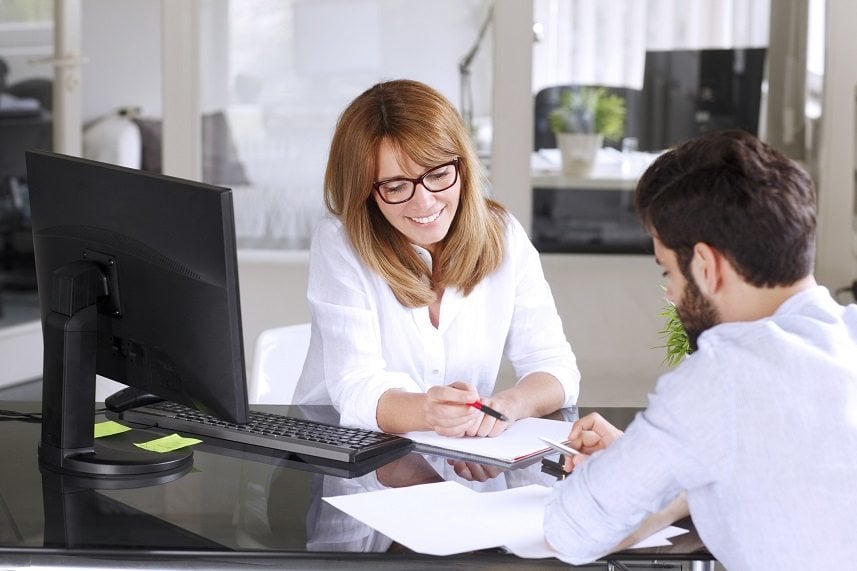 man and woman going over paperwork