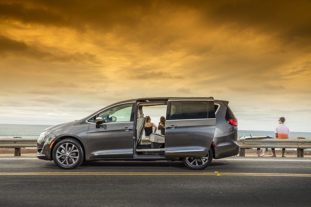 Profile view of gray Chrysler Pacifica with back door open