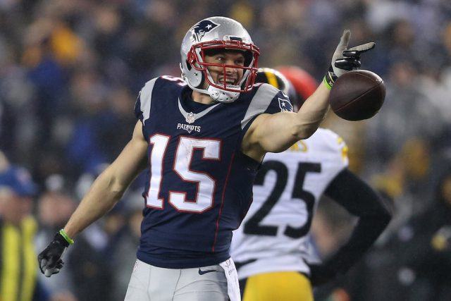 Chris Hogan drops the ball and he gestures toward the other team.