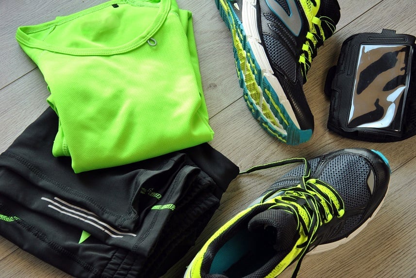 Running attire with phone and T-shirt laid out on the floor