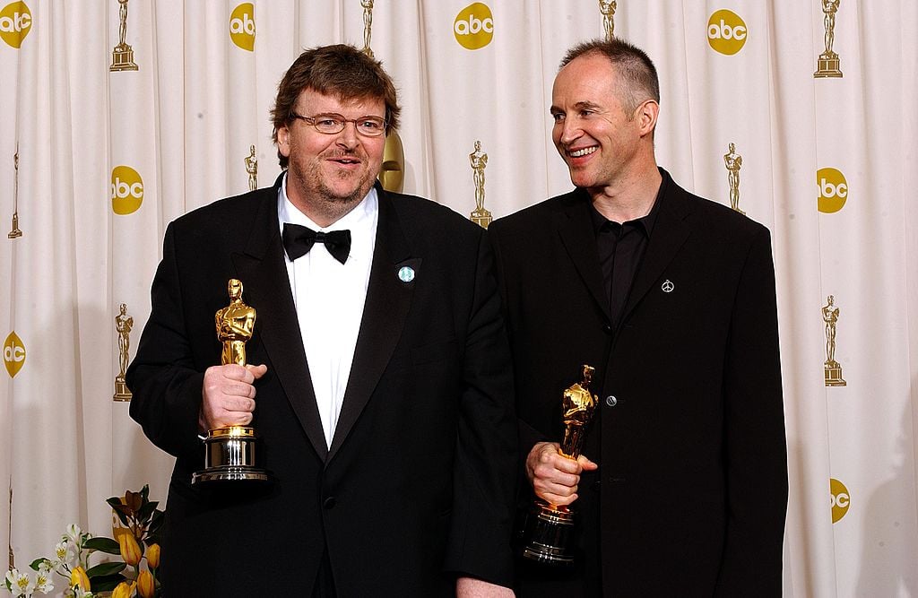 Directors Michael Moore and Michael Donavan pose during the 75th Annual Academy Awards