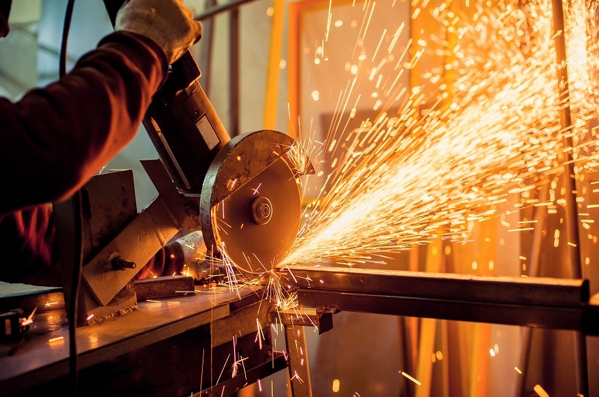 Man working with electric grinder tool
