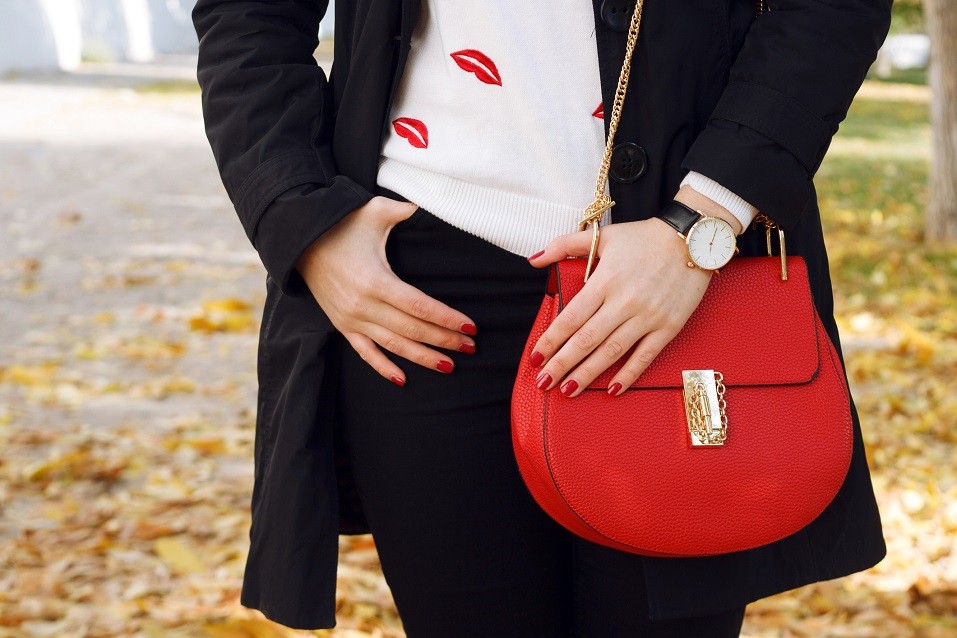 Fashion girl wearing coat ,red handbag