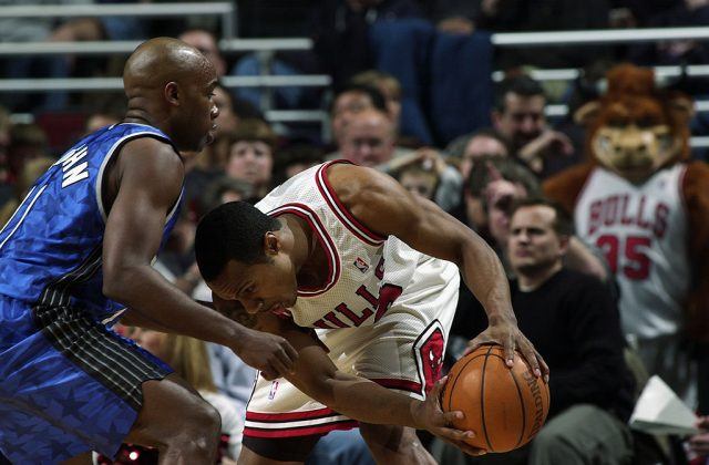Two basketball players on a court. Two basketball players on a court.