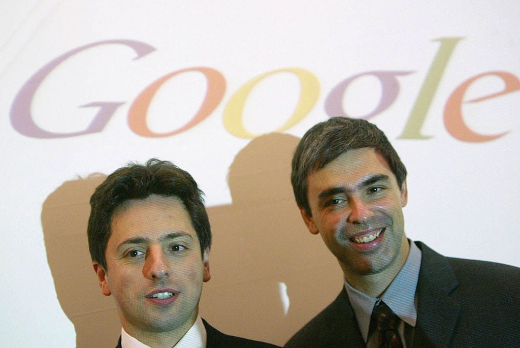 Google founders Sergey Brin (L) and Larry Page pose for photographers prior to presenting their new Google Print product at the Frankfurt Book Fair