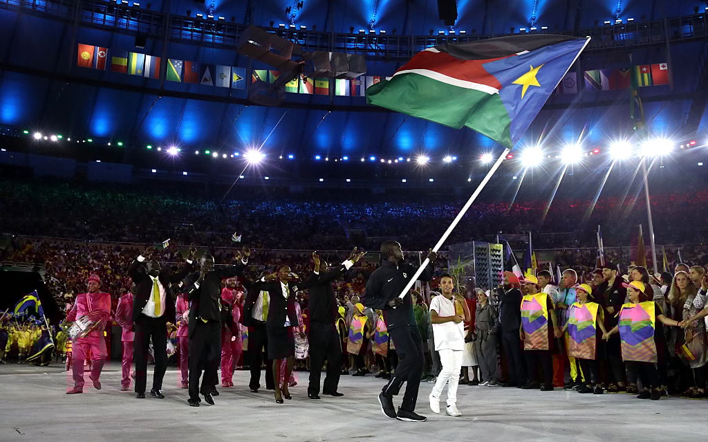Guor MArial of South Sudan carries the flag