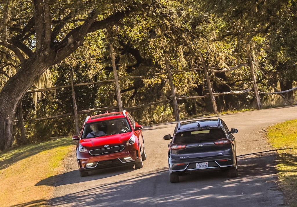 Two 2017 Kia Niros exchange greetings