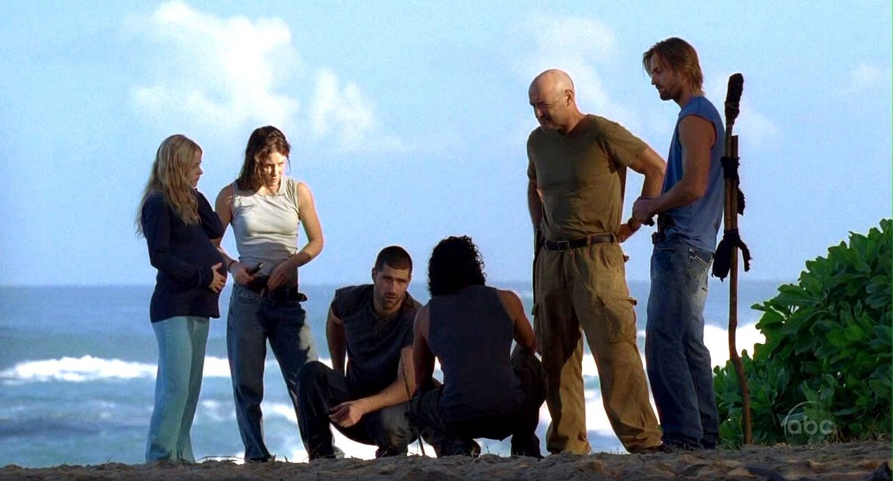 The cast of 'Lost' standing on a cliff together. 