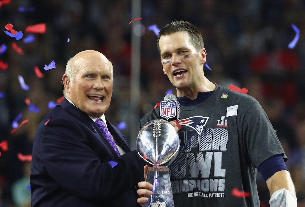 Tom Brady celebrates winning Super Bowl 51 as he holds the Lombardi Trophy.