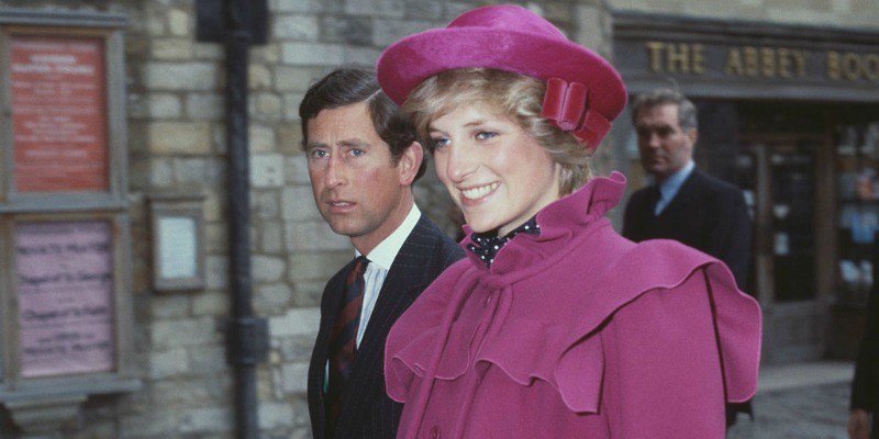 Prince Charles and Princess Diana are walking side by side.
