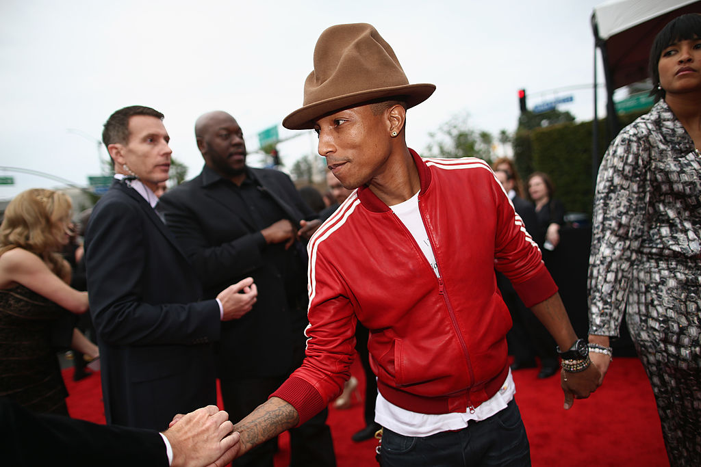Recording artist Pharrell Williams and Helen Lasichanh attend the 56th GRAMMY Awards