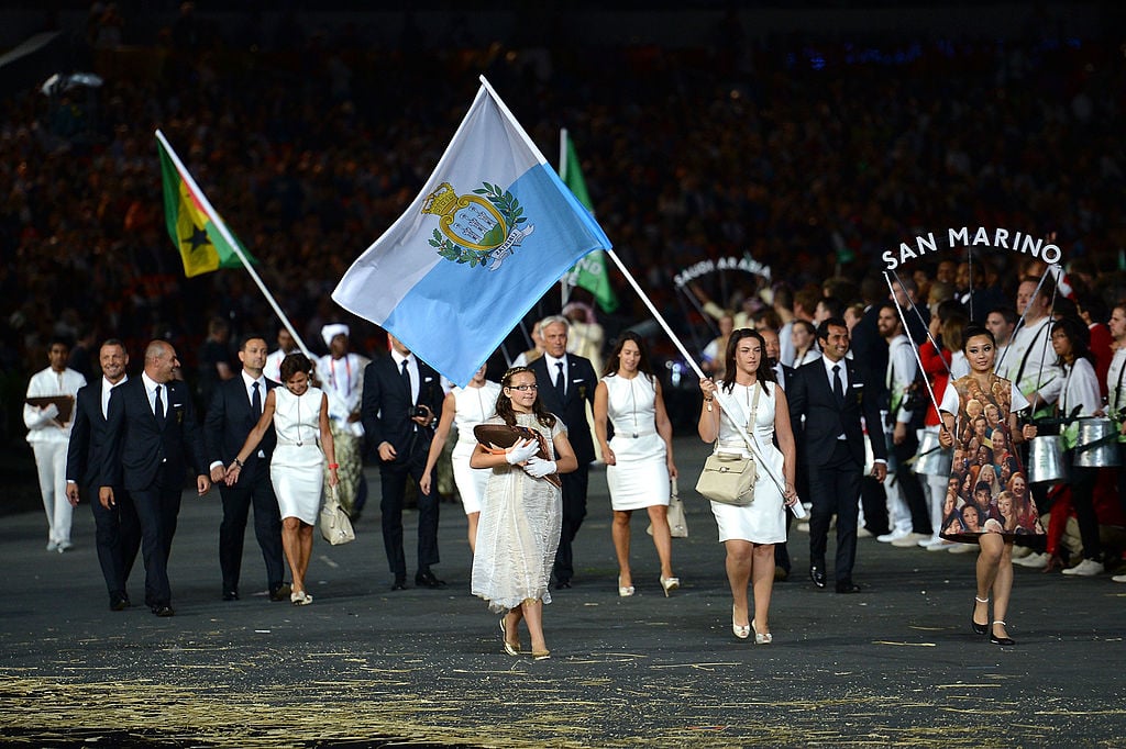 Alessandra Perilli of the San Marino Olympic shooting team carries her country's flag