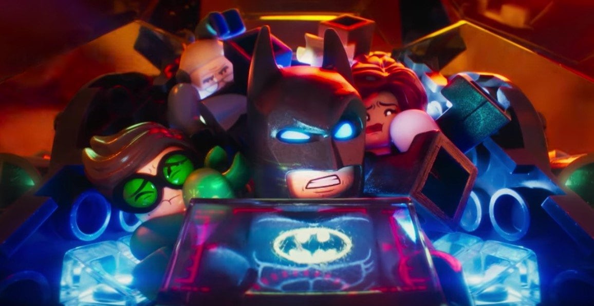 Lego Batman and his family crammed into a tiny cockpit of the Batmobile