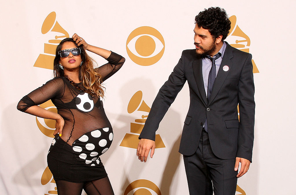 Singer M.I.A. (Maya Arulpragasam) (L) and Ben Brewer pose in the press room
