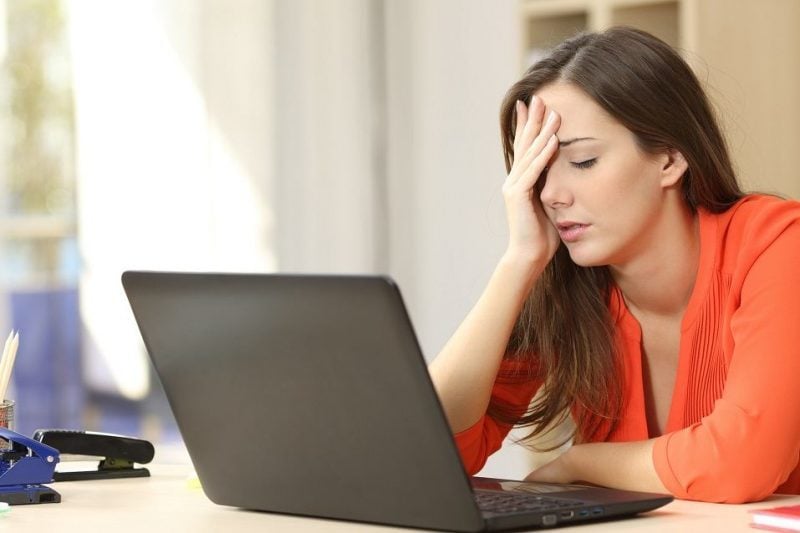 stressed woman on a laptop