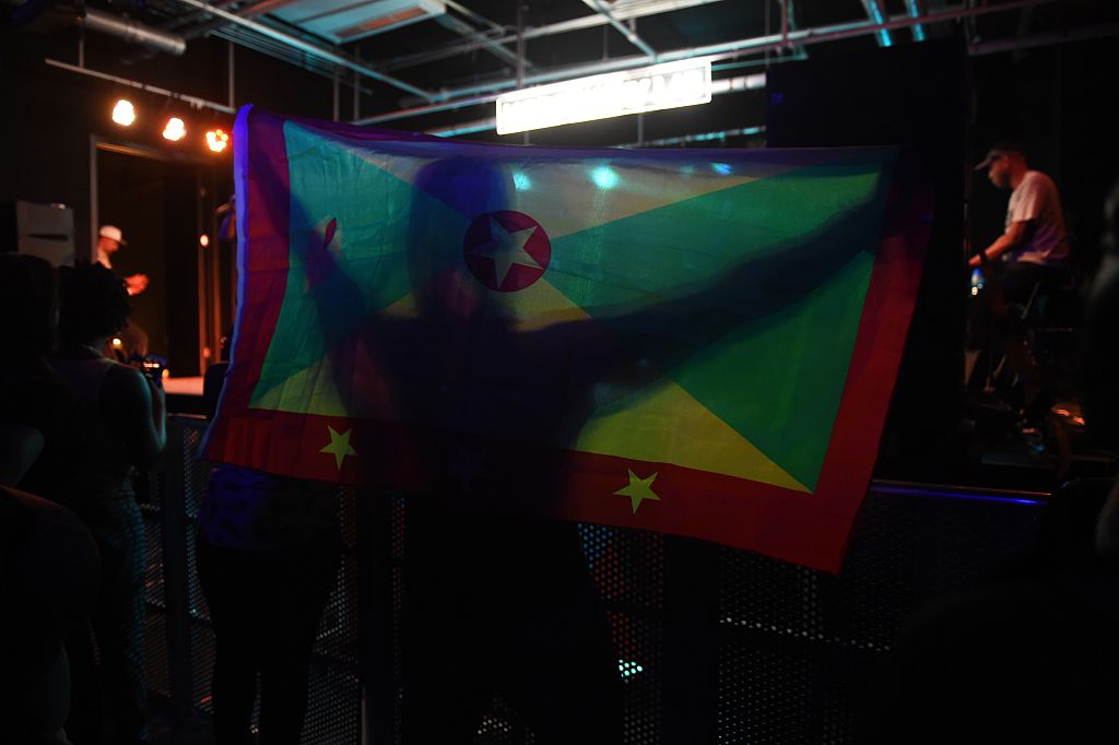 fan holding the flag of Grenada
