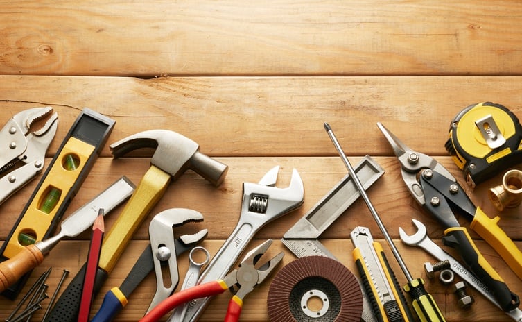 Variety of tools on wood planks