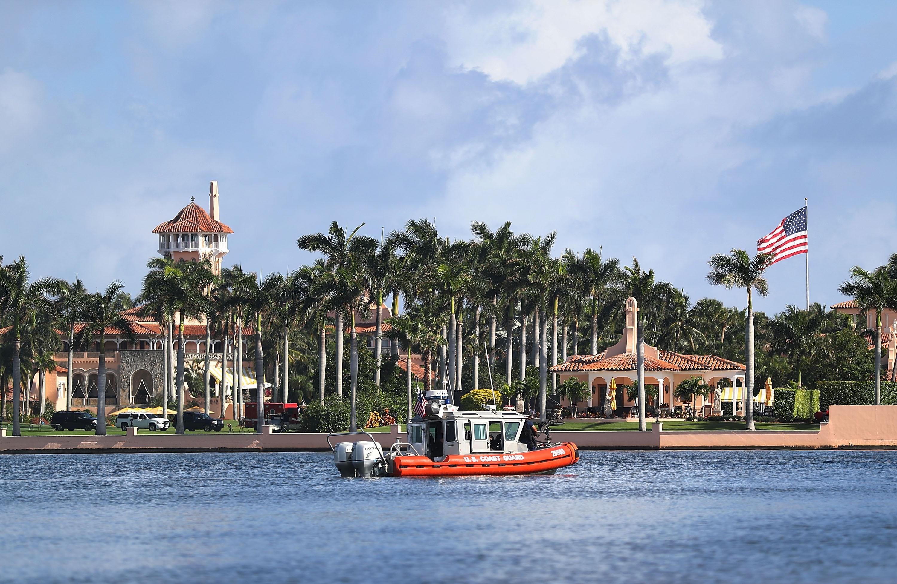 A U.S. Coast Guard boat passes the Mar-a-Lago resort