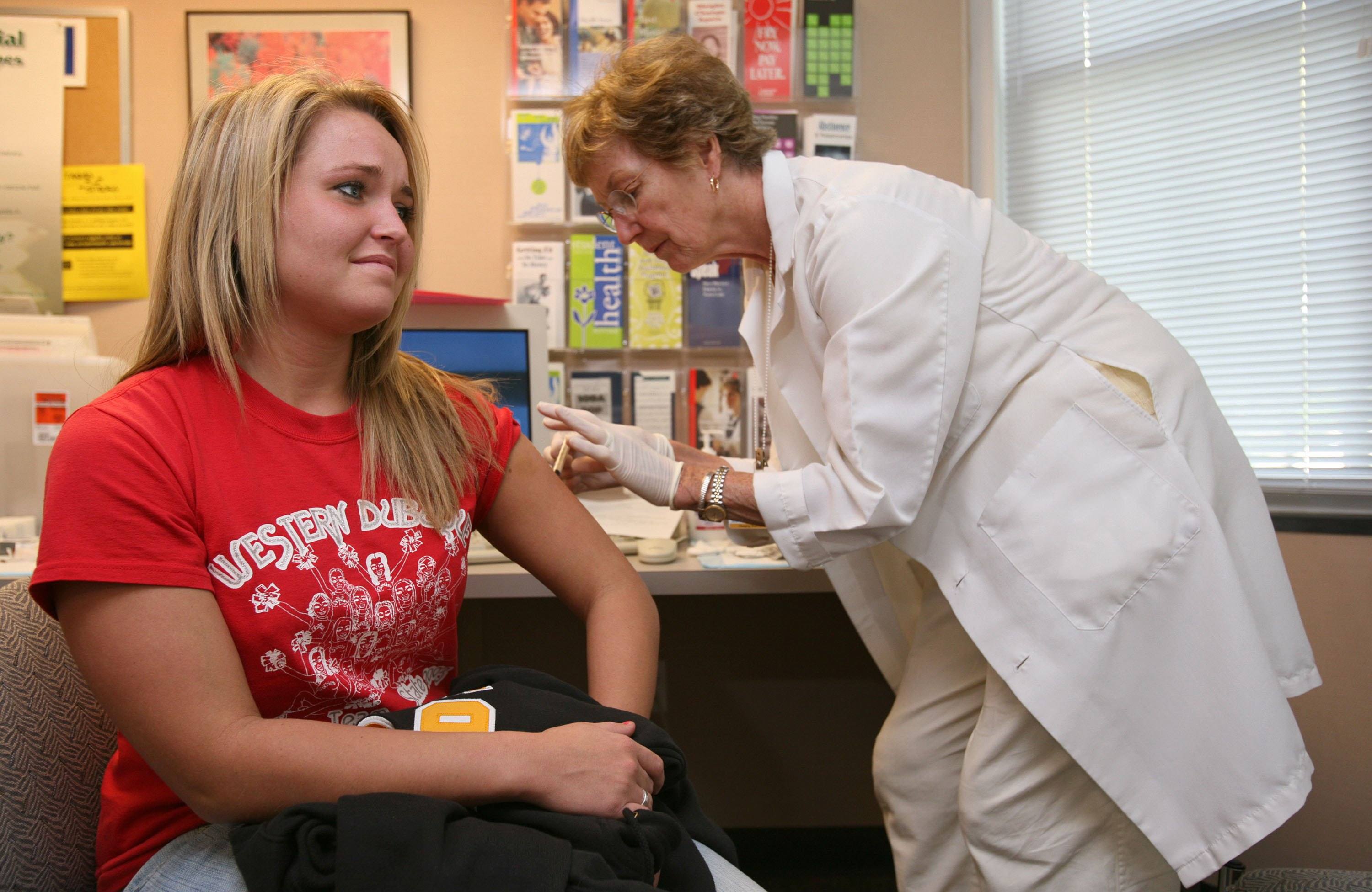A college student receives a Measles vaccine