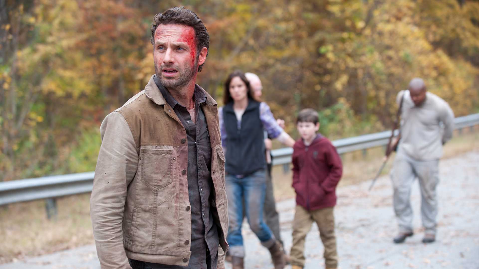 Rick stands with a bloodied forehead Rick stands with a bloodied forehead