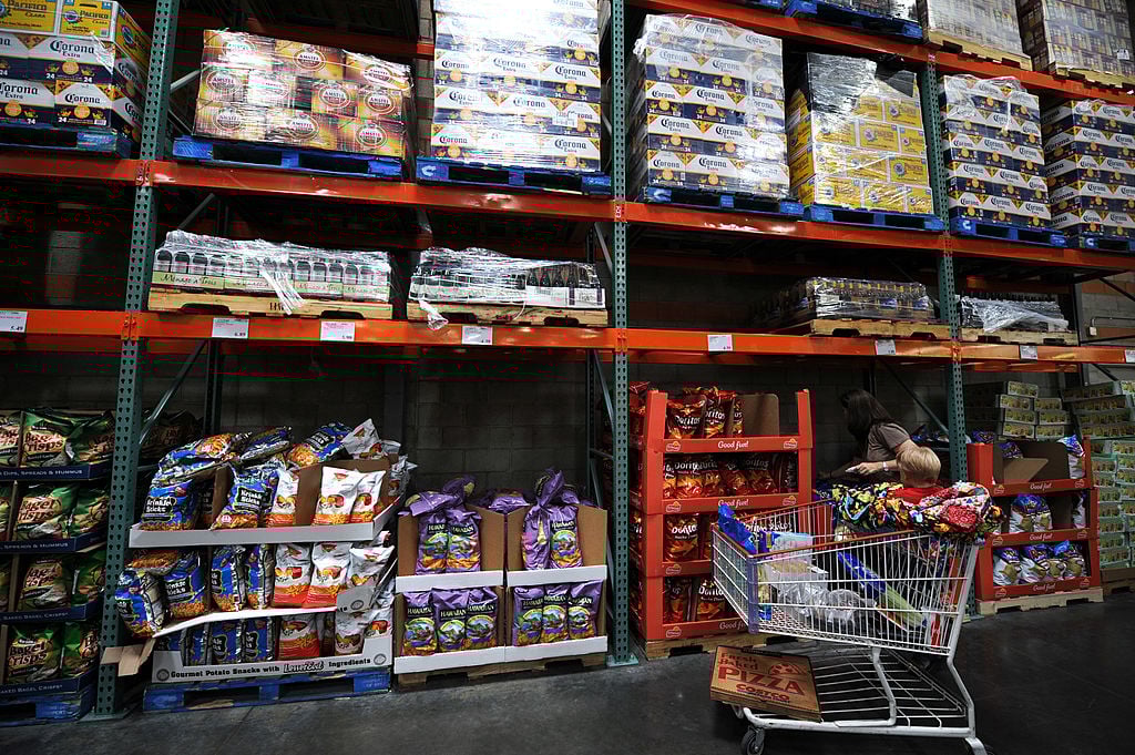 A woman shops at the low cost, high volume Costco supermarket warehouse -- the opposite of the "buy nothing" lifestyle
