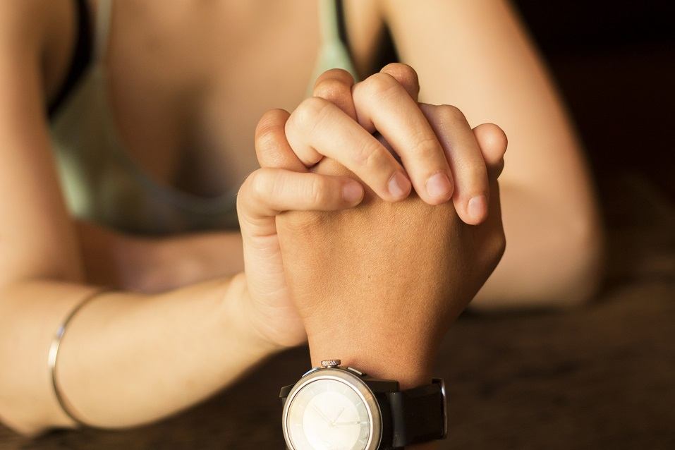 A couple holds hands