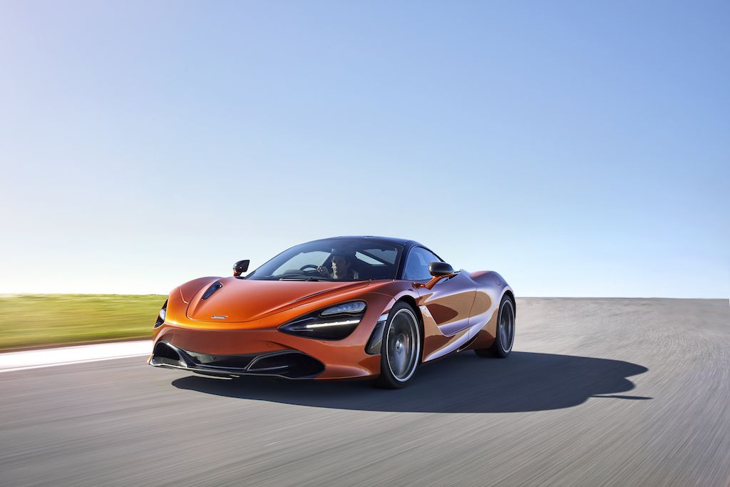2018 McLaren 720S Super Series speeding down a road.