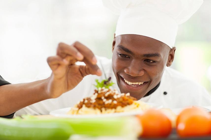 Afro American chef in restaurant kitchen